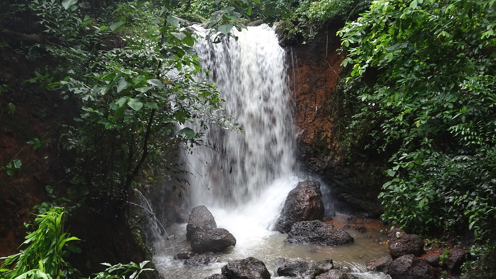 shower under verna springs is one of the things to do in Goa with family