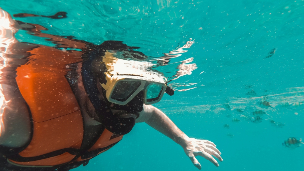 One of the best water sports in Goa is snorkelling
PC: Miltiadis Fragkidis - https://unsplash.com/photos/woman-in-orange-and-black-bikini-in-water-6xg76KY1ruk