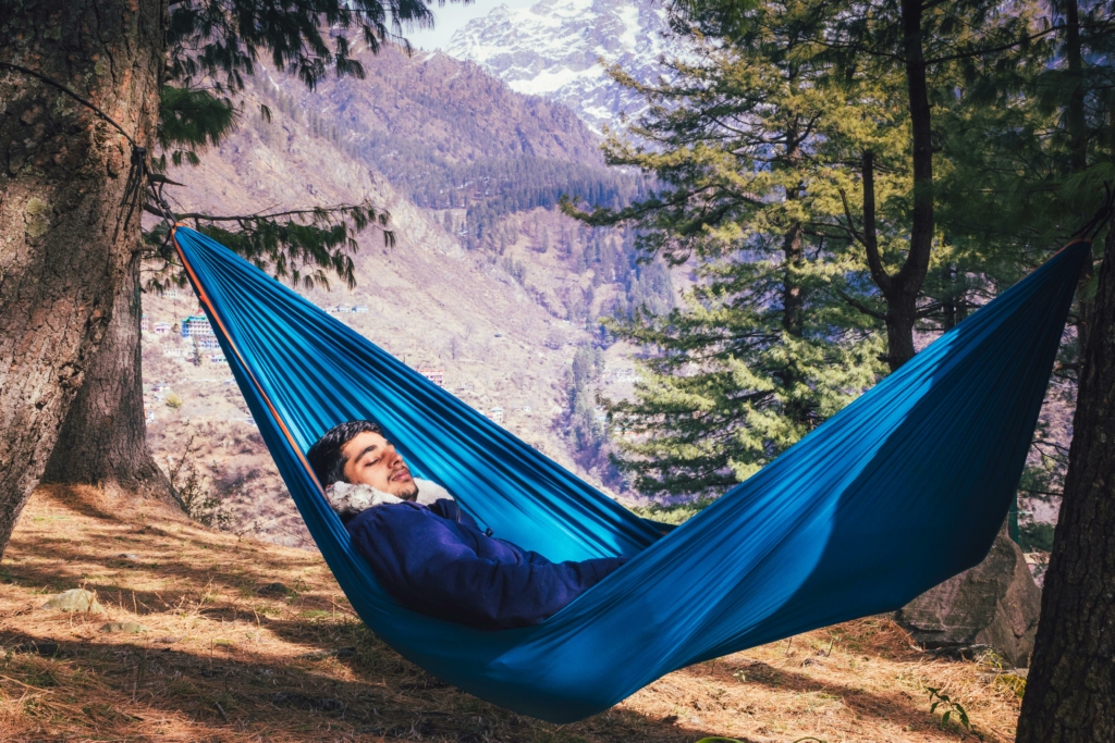 Relax in Manali
PC: Sanket Barik - https://www.pexels.com/photo/a-male-traveler-sleeping-in-a-blue-hammock-8020058/